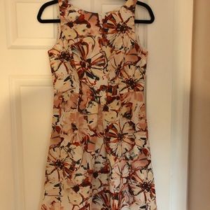 Loft dress in orange/yellow floral pattern.